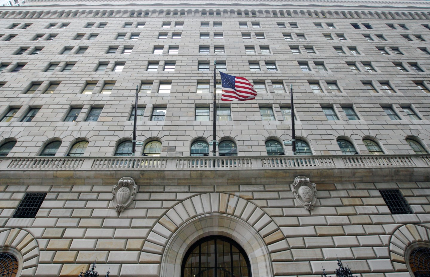 The U.S. flag hangs on the facade of the Federal Reserve Ban