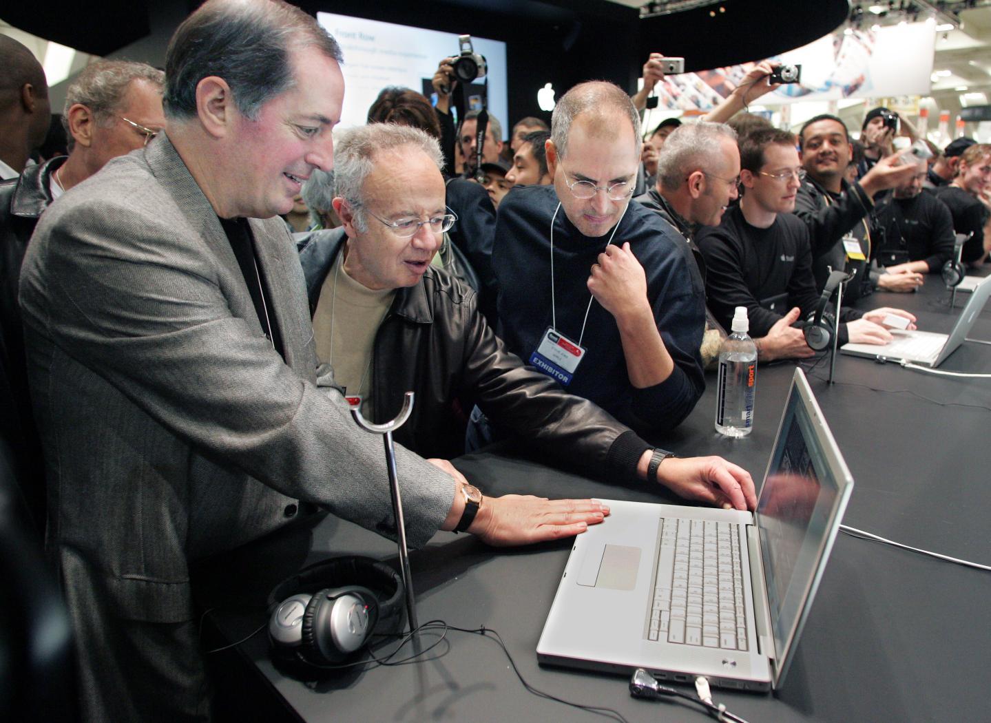 Apple CEO Jobs shows Intel CEO Otellini and former CEO Grove new MacBook Pro at Macworld