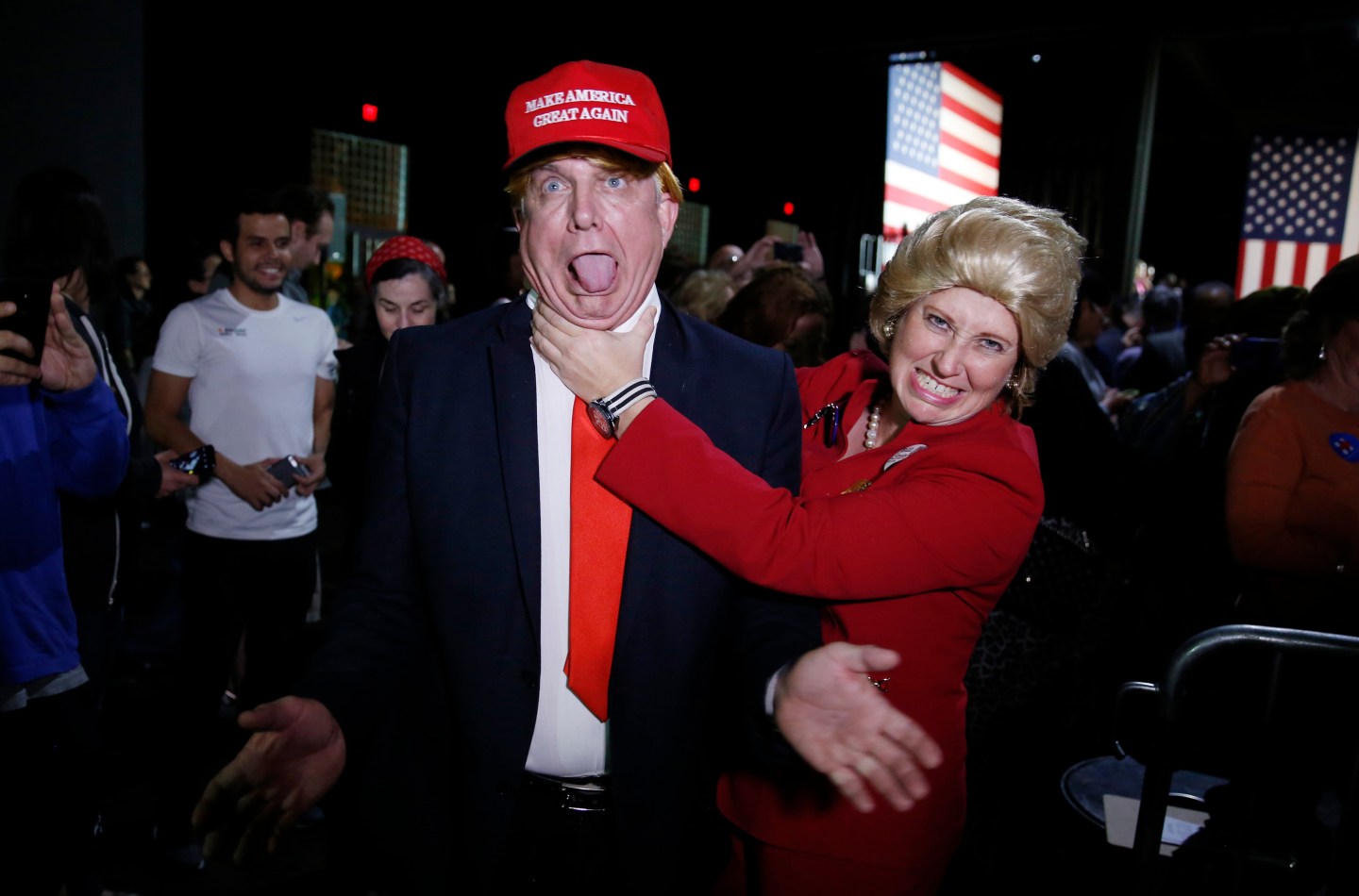 Supporters of Democratic U.S. presidential candidate Hillary Clinton, who came to her rally in costume as Republican presidential candidate Trump and as Mrs. Clinton attend her Super Tuesday night party in Miami