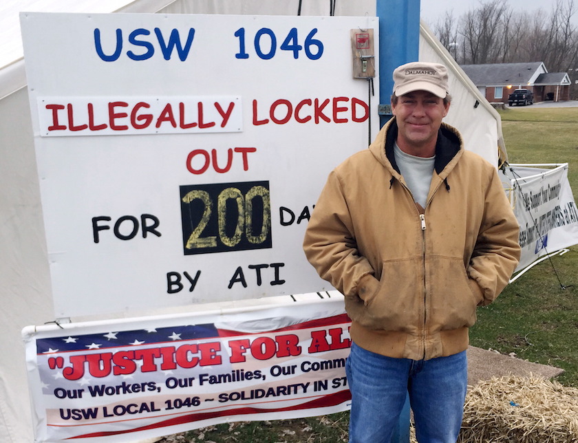Keith Newbold, a United Steelworkers member, stands at a picket outside steel manufacturer Allegheny Technologies, near Canton, Ohio