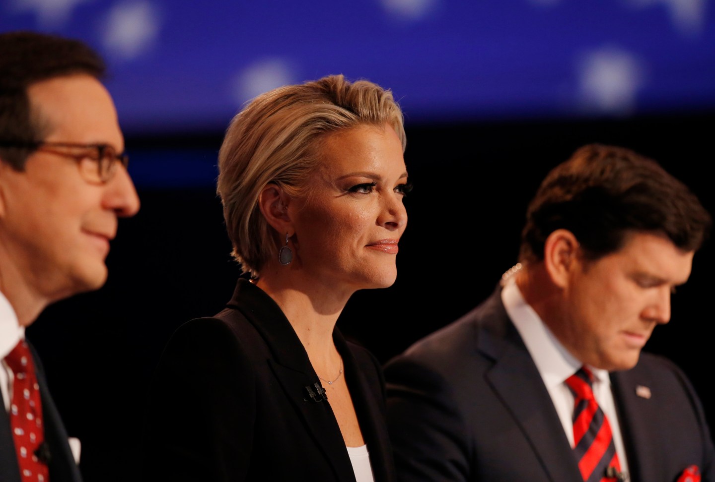 Fox News Channel anchor Kelly sits between fellow debate moderators Wallace and Baier during the debate held by Fox News for the top 2016 U.S. Republican presidential candidates in Des Moines