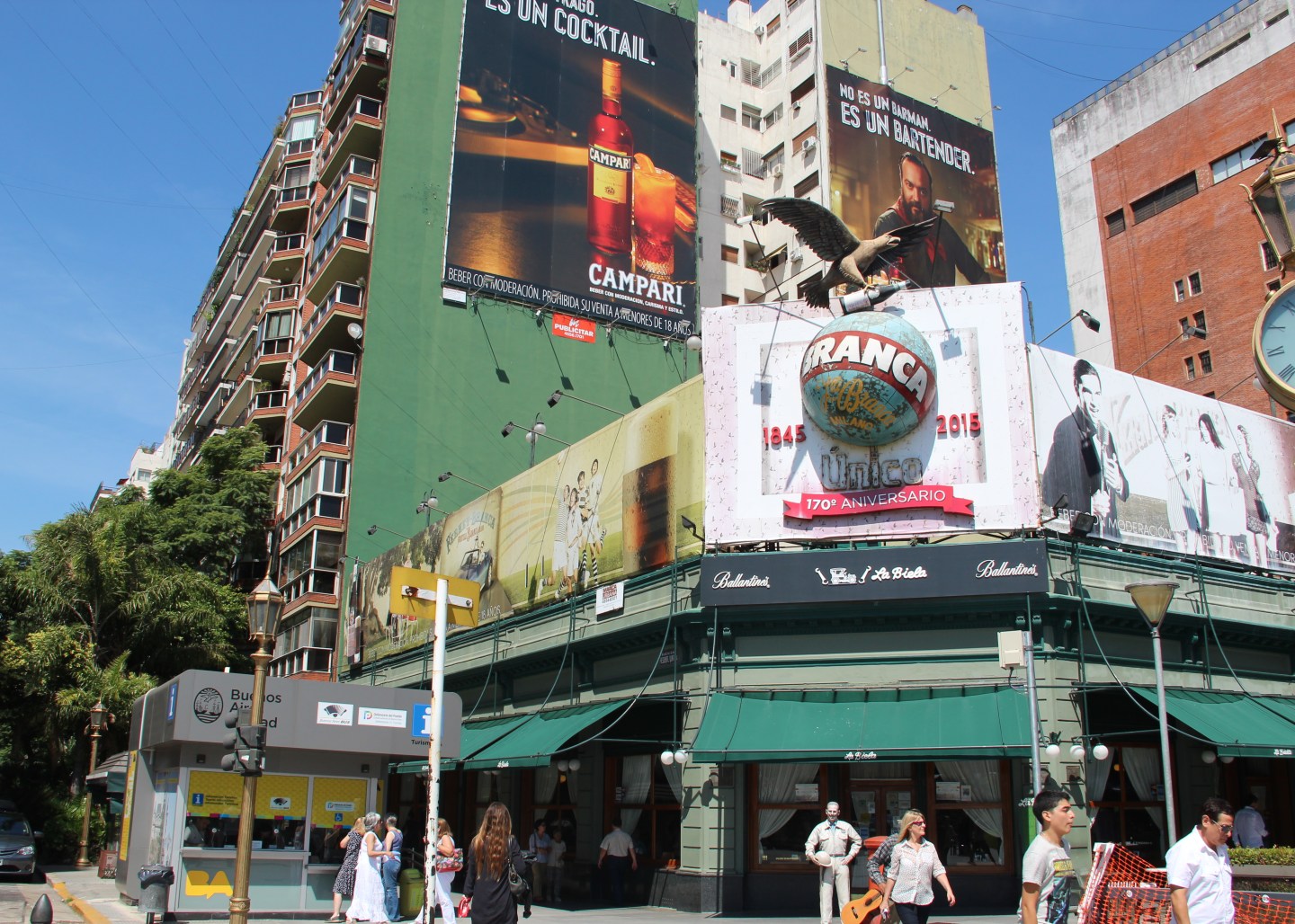 The Fernet Branca logo above a cafe in Buenos Aires with an advertisement for Campari, a new rival, behind.