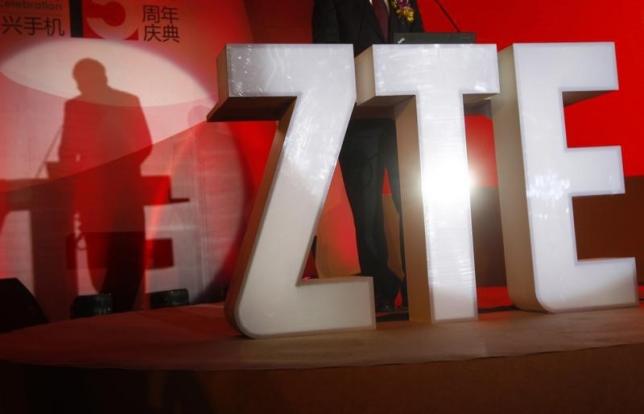 The ZTE company logo is seen as a guest delivers a speech during the company's 15th anniversary celebration in Beijing