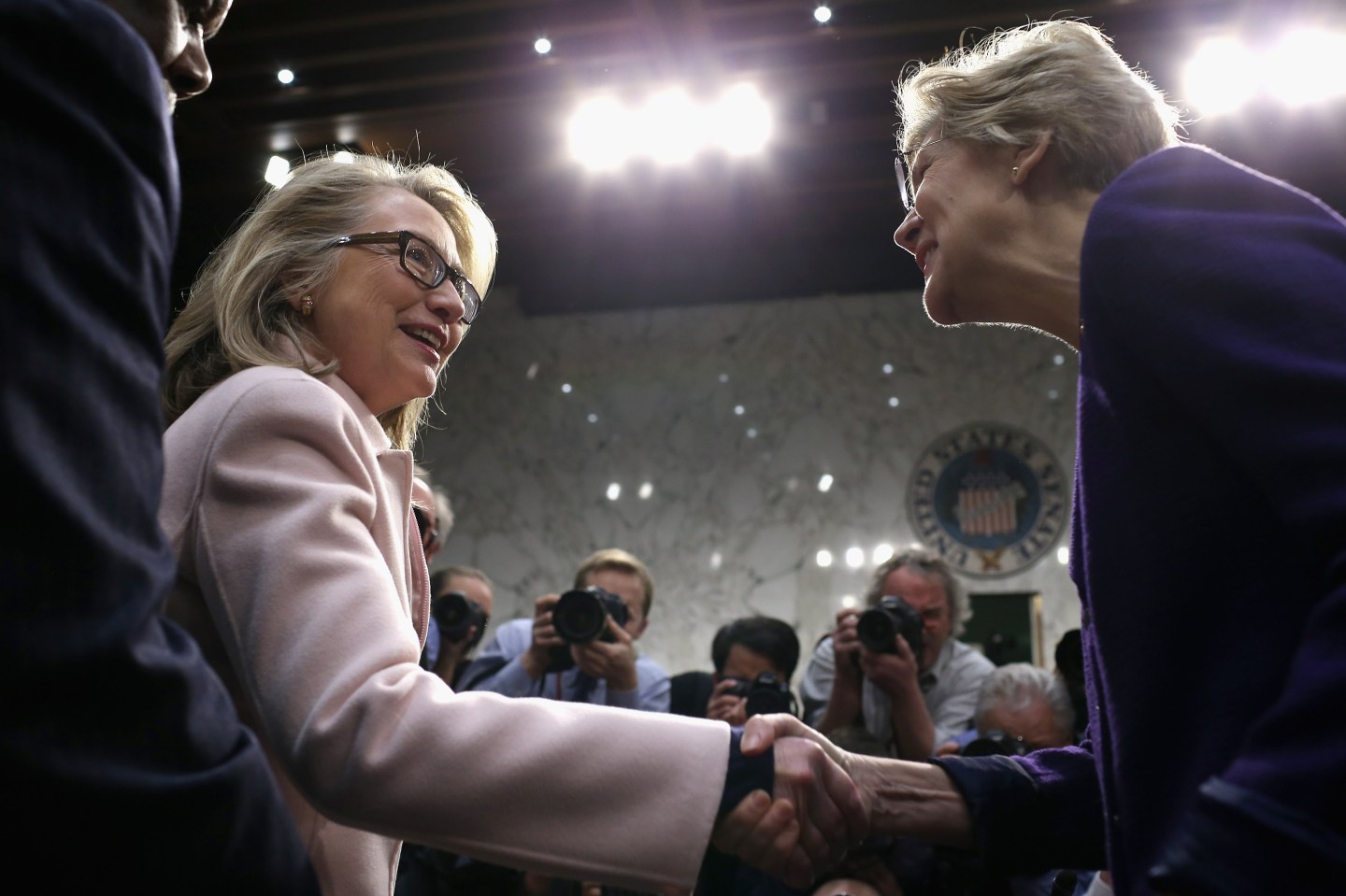 U.S. Secretary of State Hillary Clinton, Sen. John Kerry (D-MA) and Sen. Elizabeth Warren (D-MA) arrive for Kerry's confirmation hearing before the Senate Foreign Relations Committee to become the next Secretary of State in the Hart Senate Office Building on Captiol Hill January 24, 2013 in Washington, DC. Nominated by President Barack Obama to succeed Clinton as Secretary of State, Kerry has served on this committee for 28 years and was chairman for four of those years.