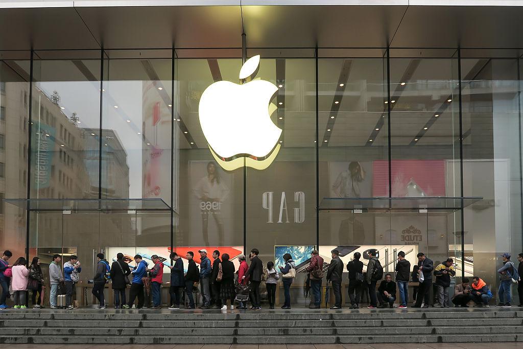 SHANGHAI, CHINA - MARCH 31: (CHINA OUT) Citizens queue up outside an Apple Store as Apple launches its iPhone SE globally on Tuesday on March 31, 2016 in Shanghai, China. Apple's new 4-inch iPhone SE packs almost all the power and features of the iPhone 6s into a package as small as - and even more affordable than - the iPhone 5s it replaces. (Photo by VCG)***_***
