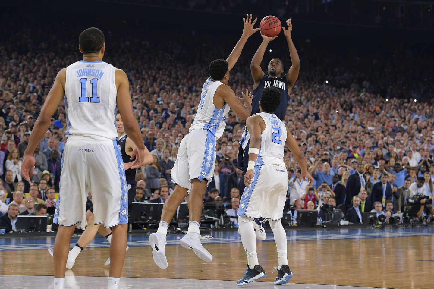 HOUSTON, TX - APRIL 04: Kris Jenkins #2 of the Villanova Wildcats puts up the game-winning three-point shot as time expires against the North Carolina Tar Heels during the 2016 NCAA Men's Final Four Championship at NRG Stadium on April 04, 2016 in Houston, Texas. (Photo by Lance King/Getty Images)
