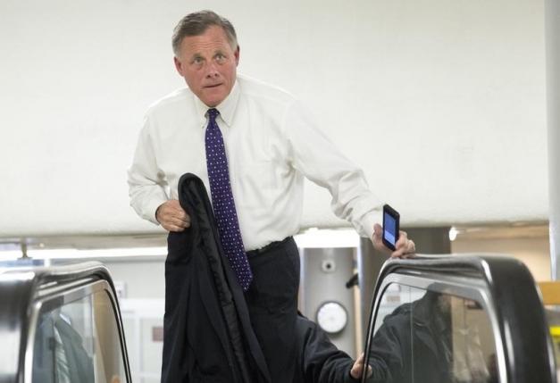 Senator Richard Burr (R-NC) walks to the Senate Chamber to vote on legislation for funding the Department of Homeland Security