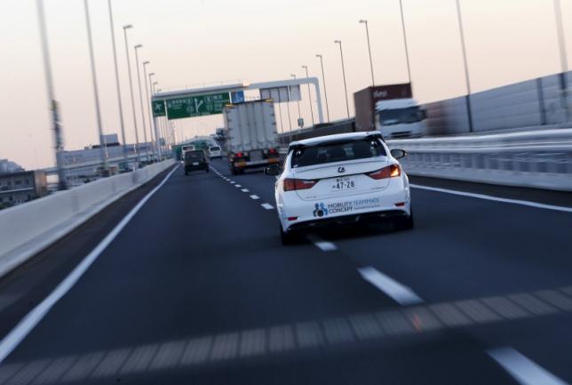Toyota Motor Corp's self-driving technology "Mobility Teammate Concept" prototype car changes lane on the Metropolitan Expressway during the Toyota Advanced Technologies media preview in Tokyo