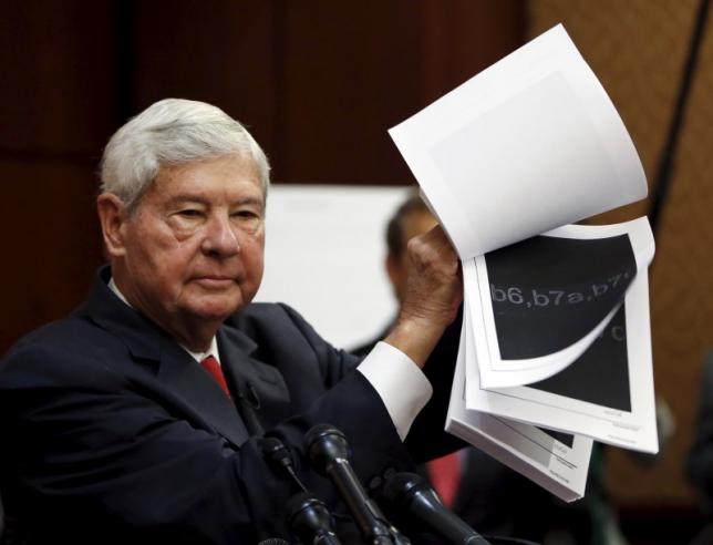 Former Senator Graham shows blacked out 9/11 financial report at news conference on Capitol Hill in Washington to unveil "The Transparency for the Families of 9/11 Victims Act"