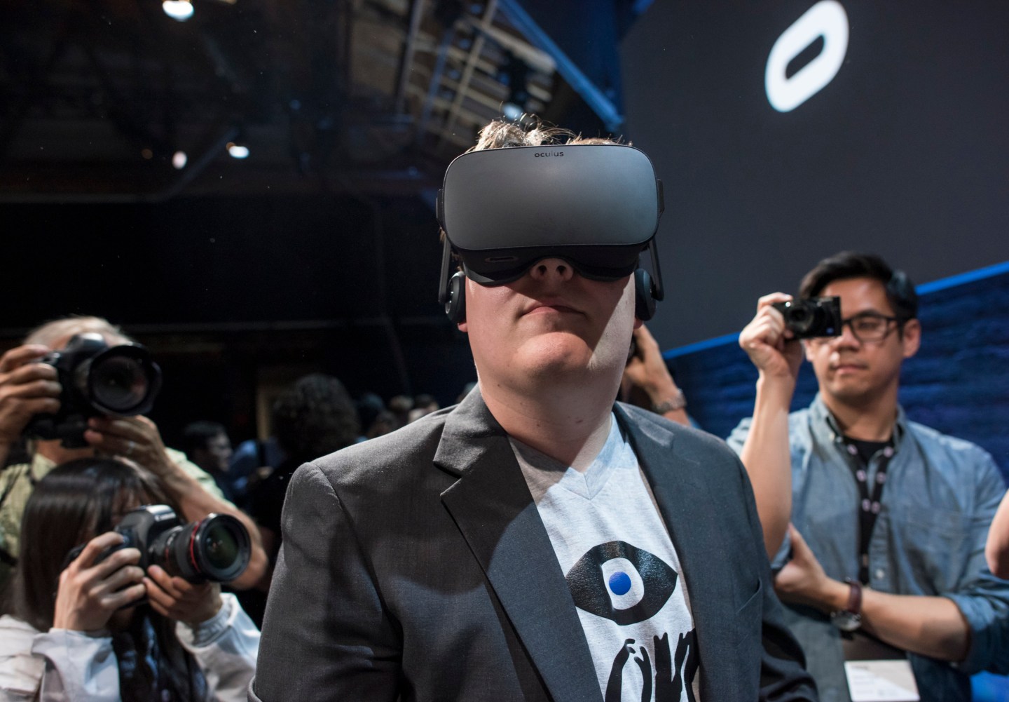 Palmer Luckey, co-founder of Oculus VR. Inc. and creator of the Oculus Rift, demonstrates the new Oculus Rift headset to the media during the Oculus VR Inc. "Step Into The Rift" event in San Francisco, California, U.S., on Thursday, June 11, 2015. Facebook Inc.'s Oculus virtual-reality headsets will work with Microsoft Corp.'s Windows 10 and use the software maker's wireless Xbox game controller. Photographer: David Paul Morris/Bloomberg *** Local Caption *** Palmer Luckey