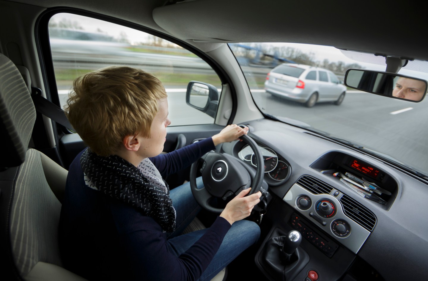 Woman Driving A Car