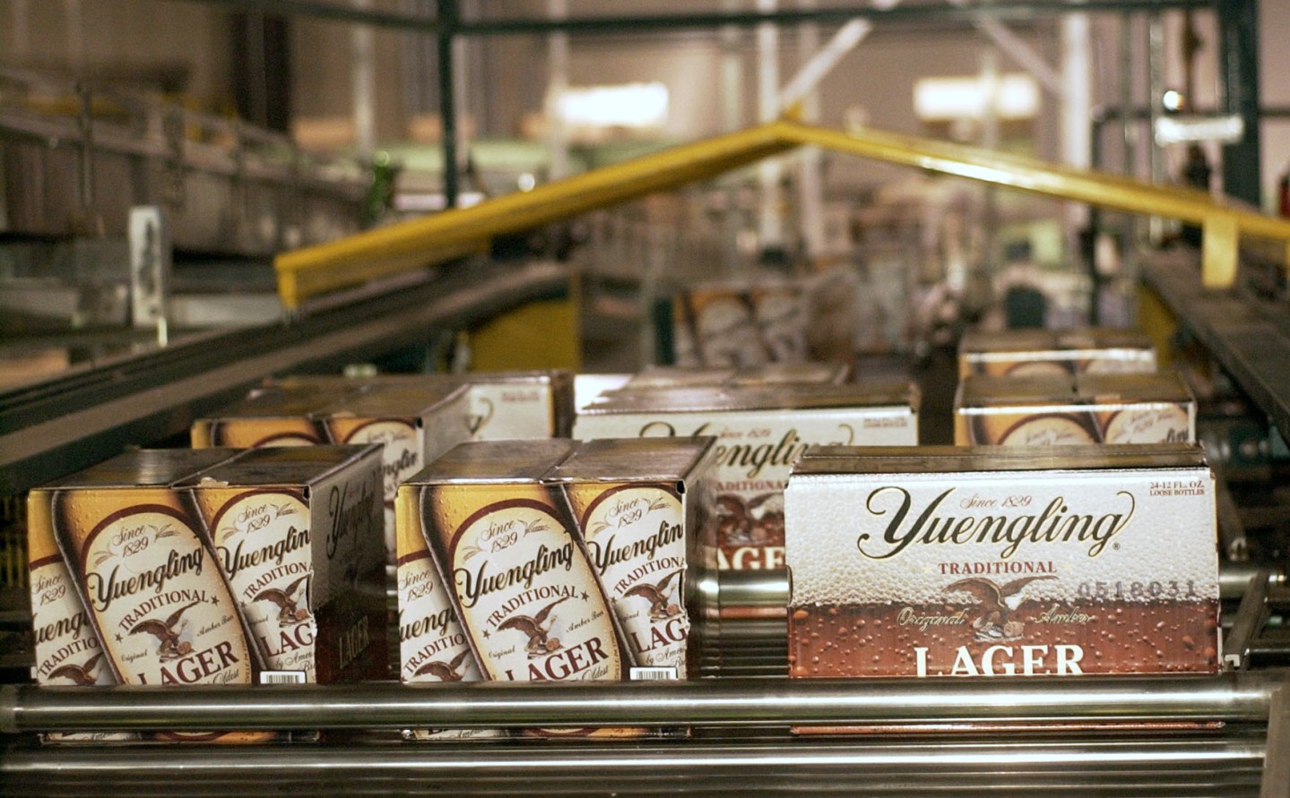 Cases of lager roll off the assembly line at the Yuengling b