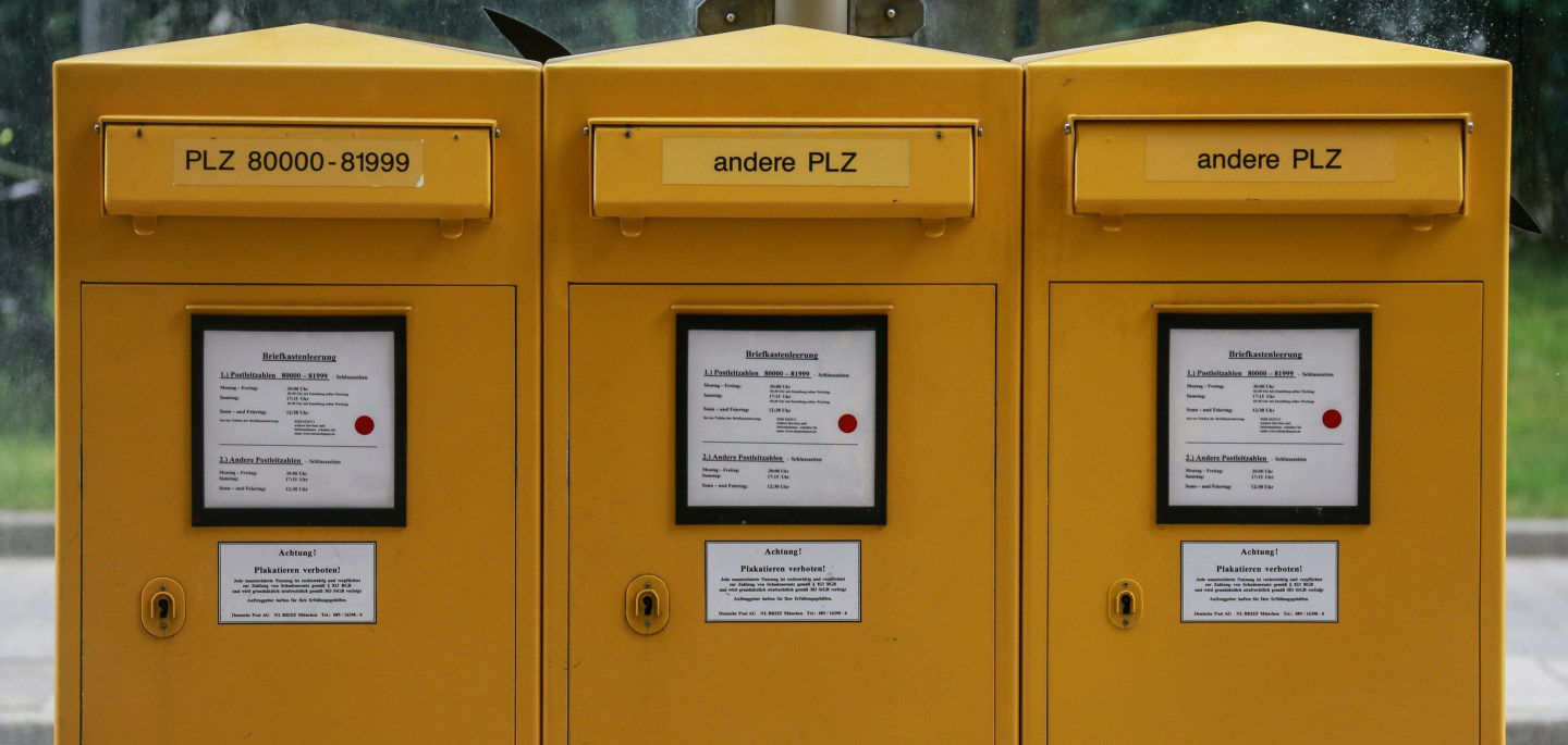 Letterboxes of German mail carrier Deutsche Post are seen during a demonstration in Munich