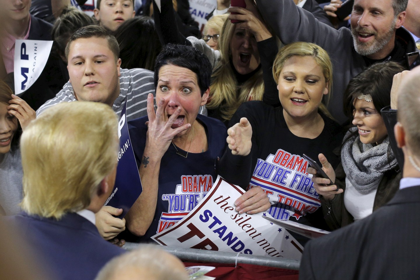 Audience member Robin Roy reacts as U.S. Republican presidential candidate Donald Trump greets her at a campaign rally in Lowell