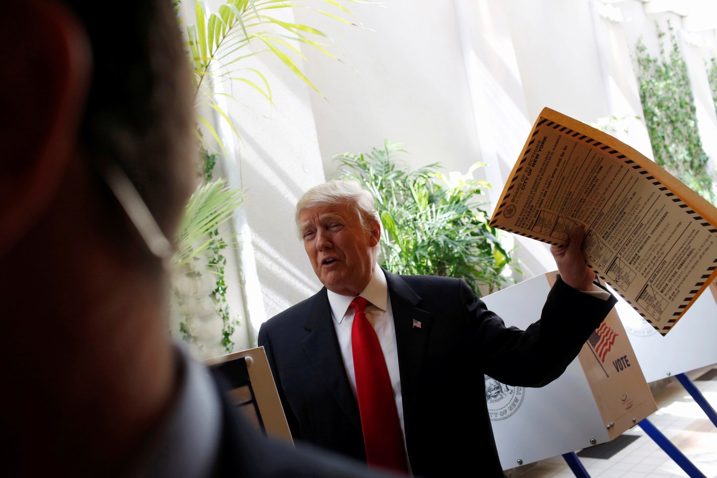 Republican presidential candidate Donald Trump shows his ballot for the New York primary election in the Manhattan borough of New York City, U.S.