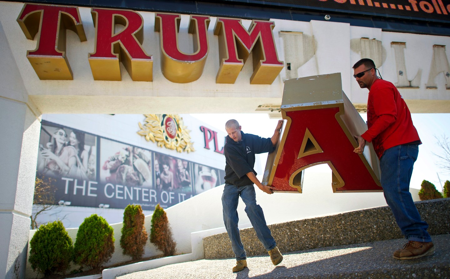 Nordaby and Demidio, of Calvi Electric, remove the letter 'A' from the signage of Trump Plaza Casino in Atlantic City, New Jersey