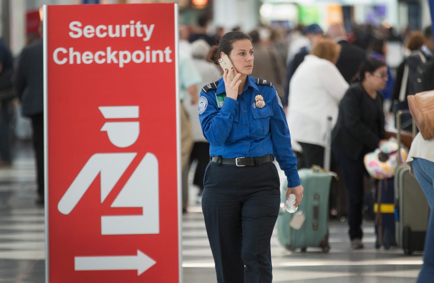 A security checkpoint staffed by TSA workers at Chicago's O'Hare Airport
