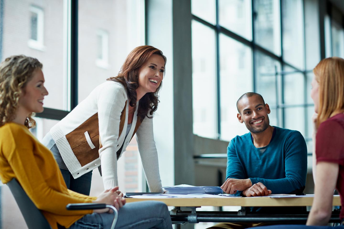 Smiling coworkers in meeting