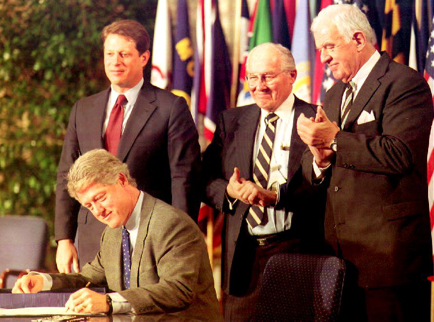 U.S. President Bill Clinton signs the North Americ