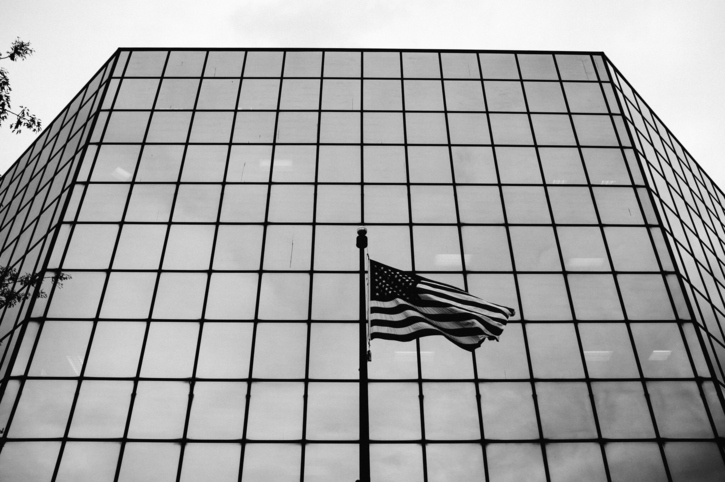 Low Angle View Of American Flag Against Building