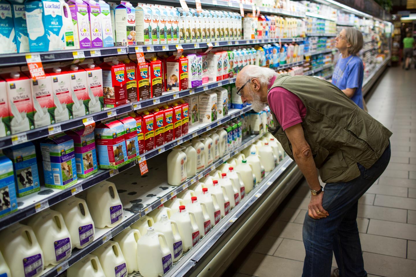 Customers Search For Milk Products At Whole Foods In Washington, DC