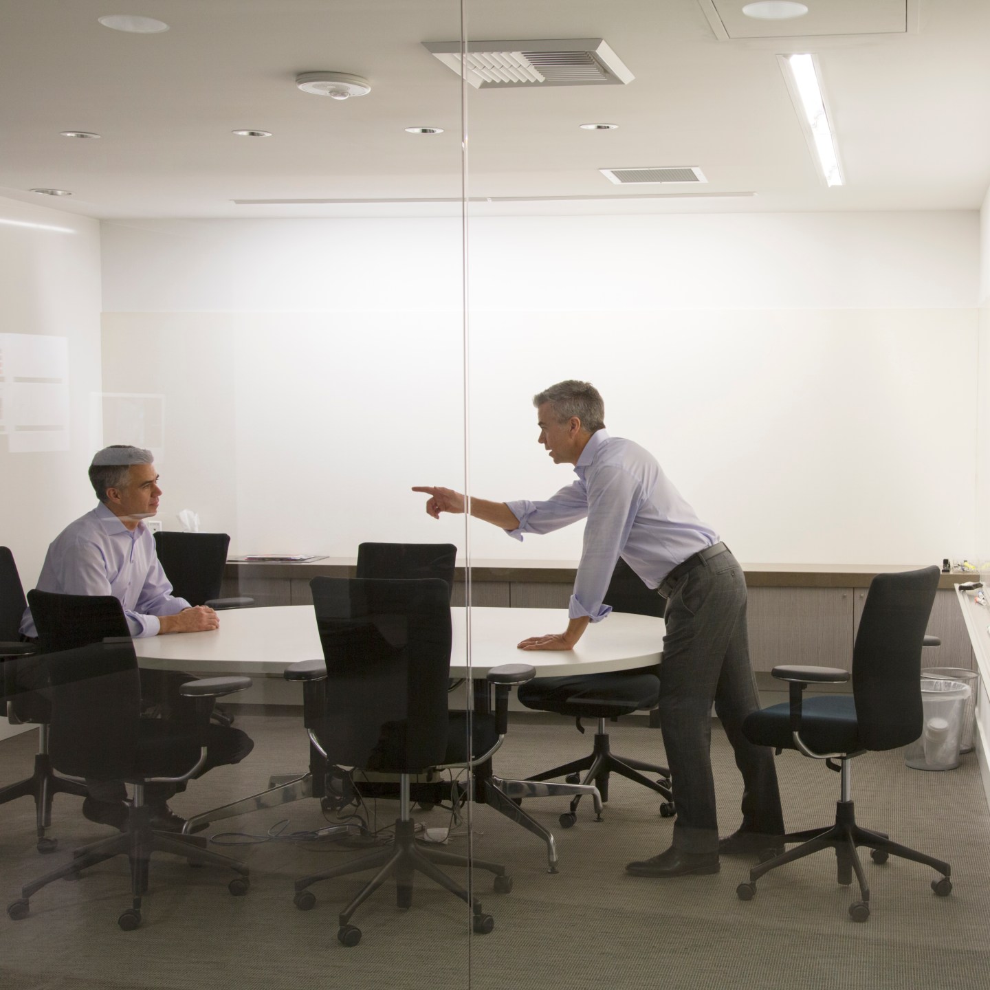 Caucasian businessmen having meeting in office