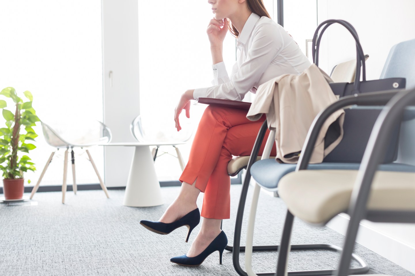 Businesswoman waiting with legs crossed in lobby
