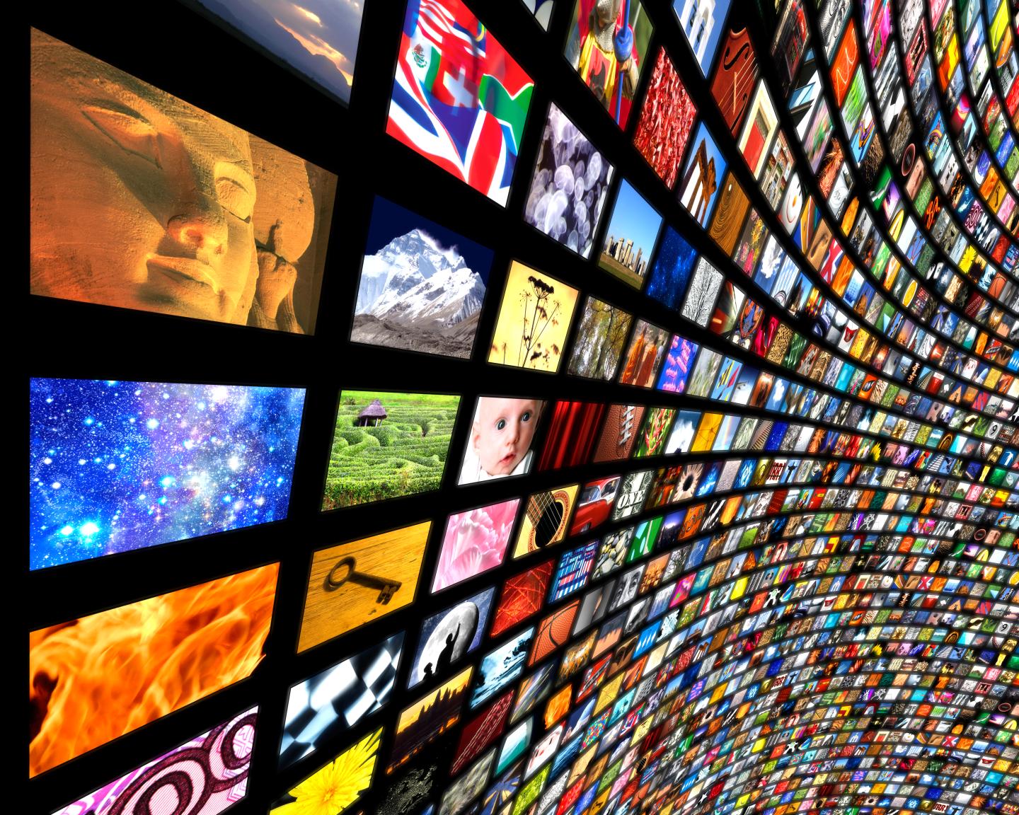 Multiple television/computer screens stretching to
