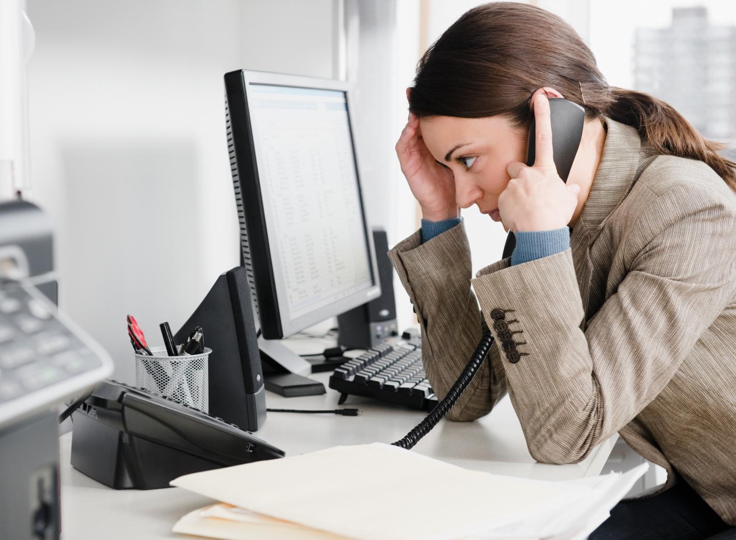 Businesswoman talking on the phone in office