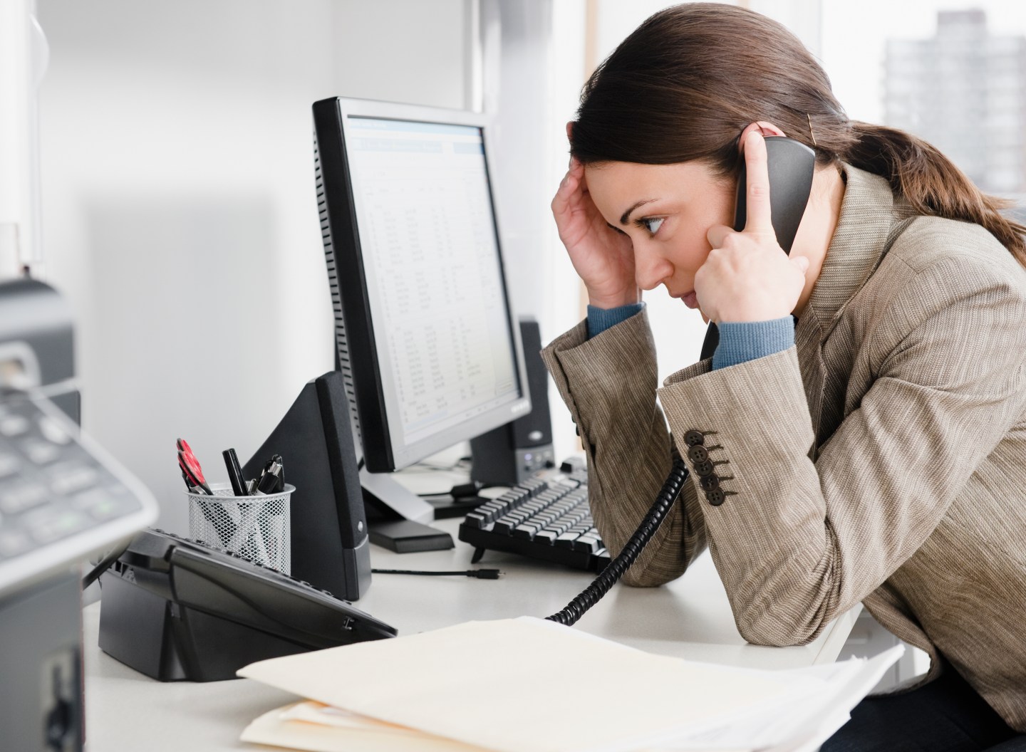 Businesswoman talking on the phone in office