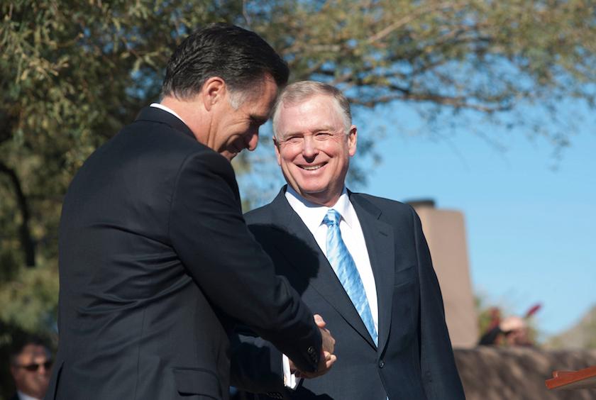 Republican presidential candidate former Massachusetts Governor Romney shakes hands with Former U.S. VP Quayle in Paradise Valley