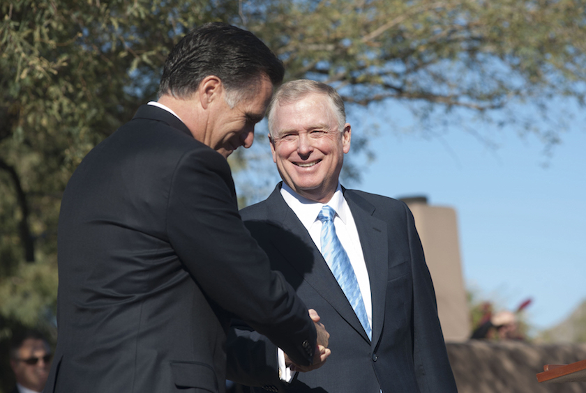 Republican presidential candidate former Massachusetts Governor Romney shakes hands with Former U.S. VP Quayle in Paradise Valley