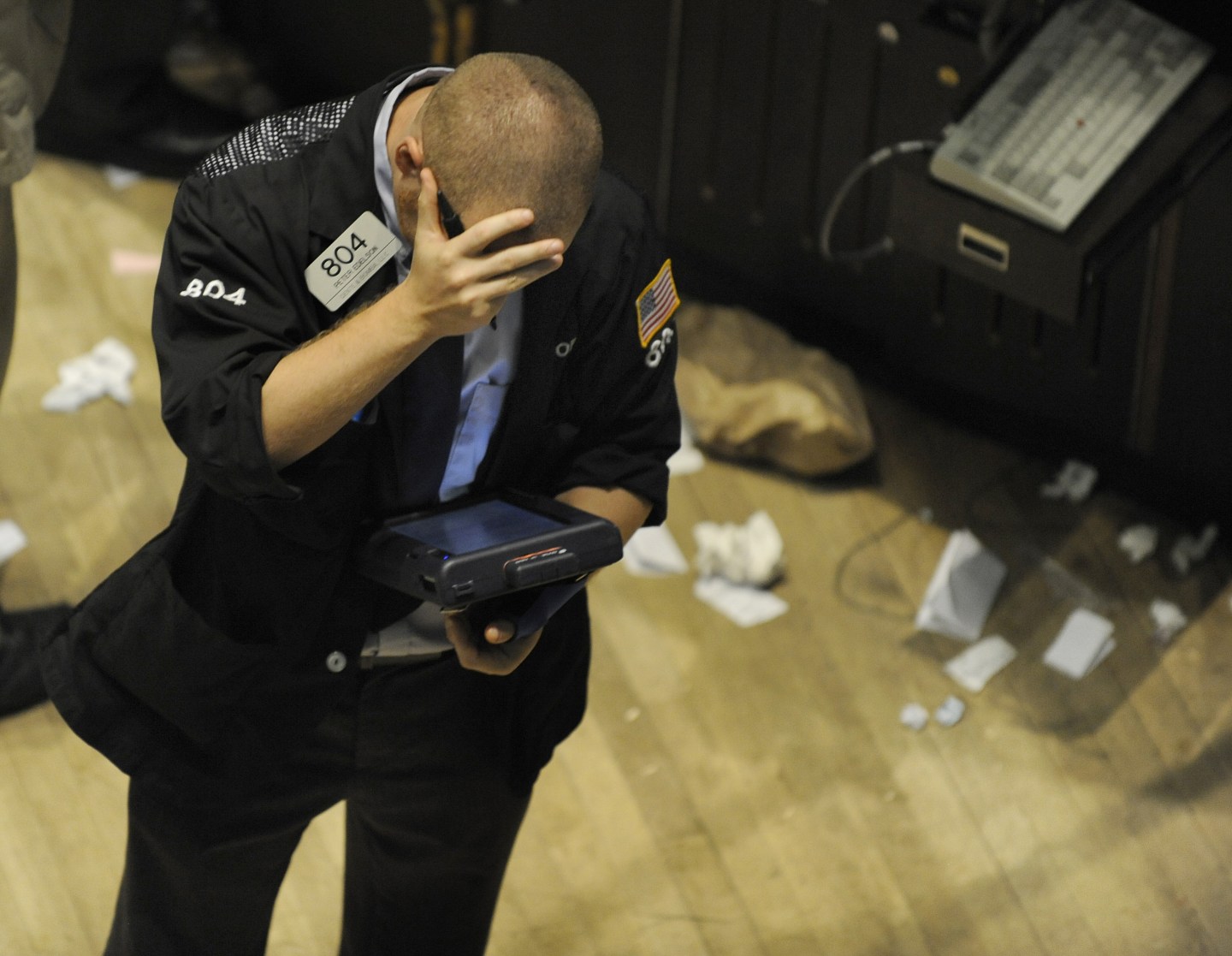 A trader reacts on the floor of the New