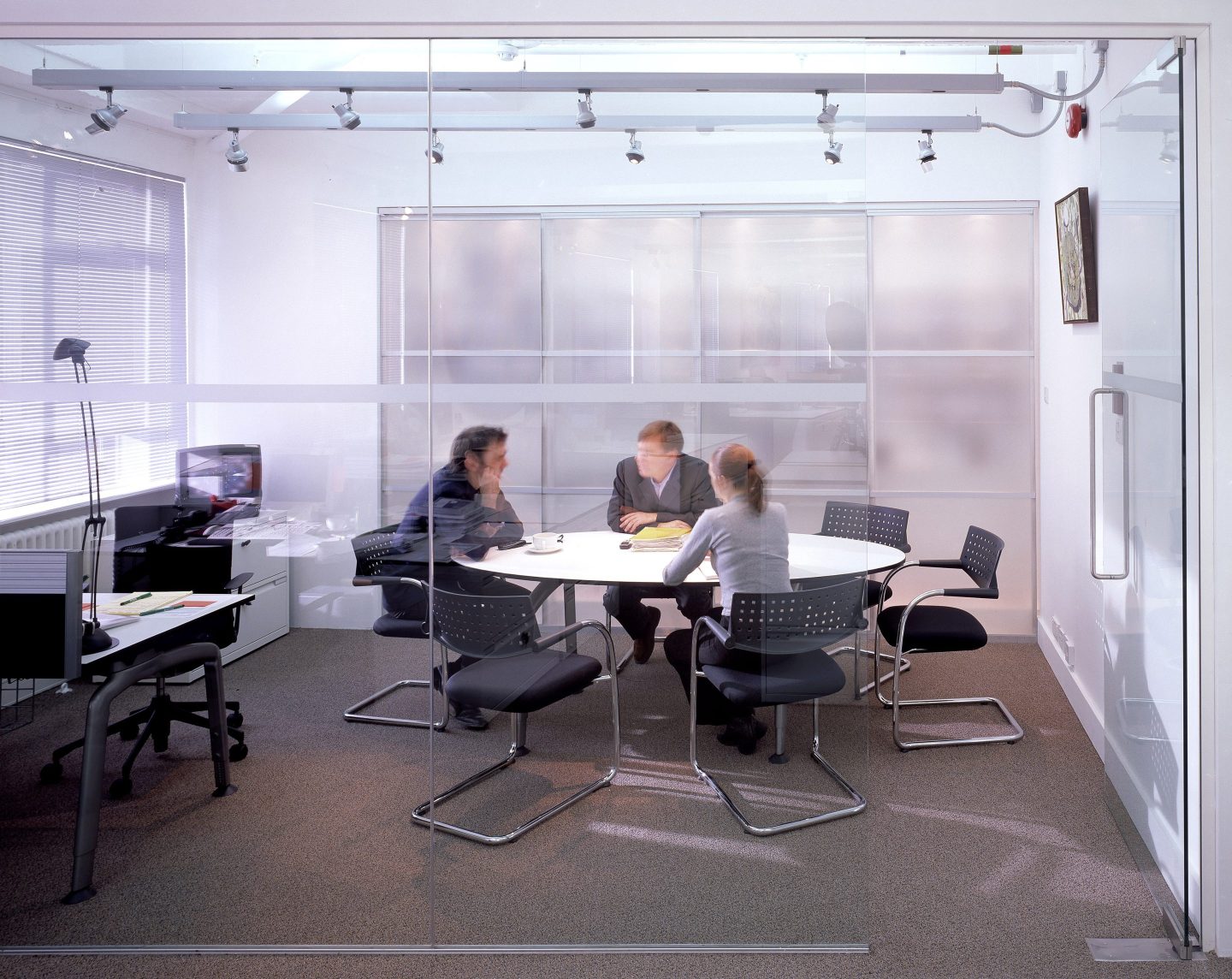 office workers sitting around a table