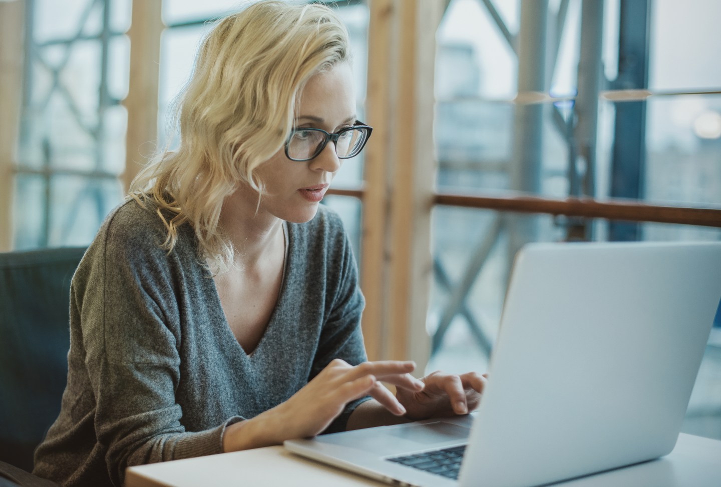 Woman working by computer