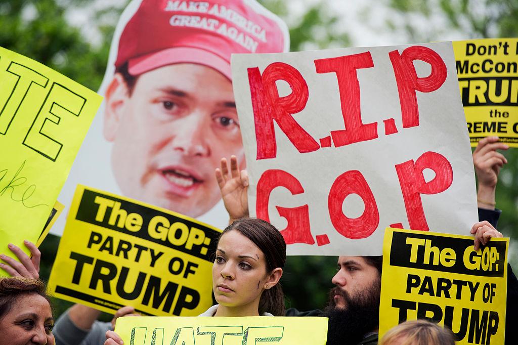 UNITED STATES - MAY 12: Groups of protesters, including United We Dream, demonstrate outside of the National Republican Senatorial Committee during a meeting between Republican presidential candidate Donald Trump, Senate Majority Leader Mitch McConnell, R-Ky., and Senate republican leaders, May 12, 2016. (Photo By Tom Williams/CQ Roll Call)
