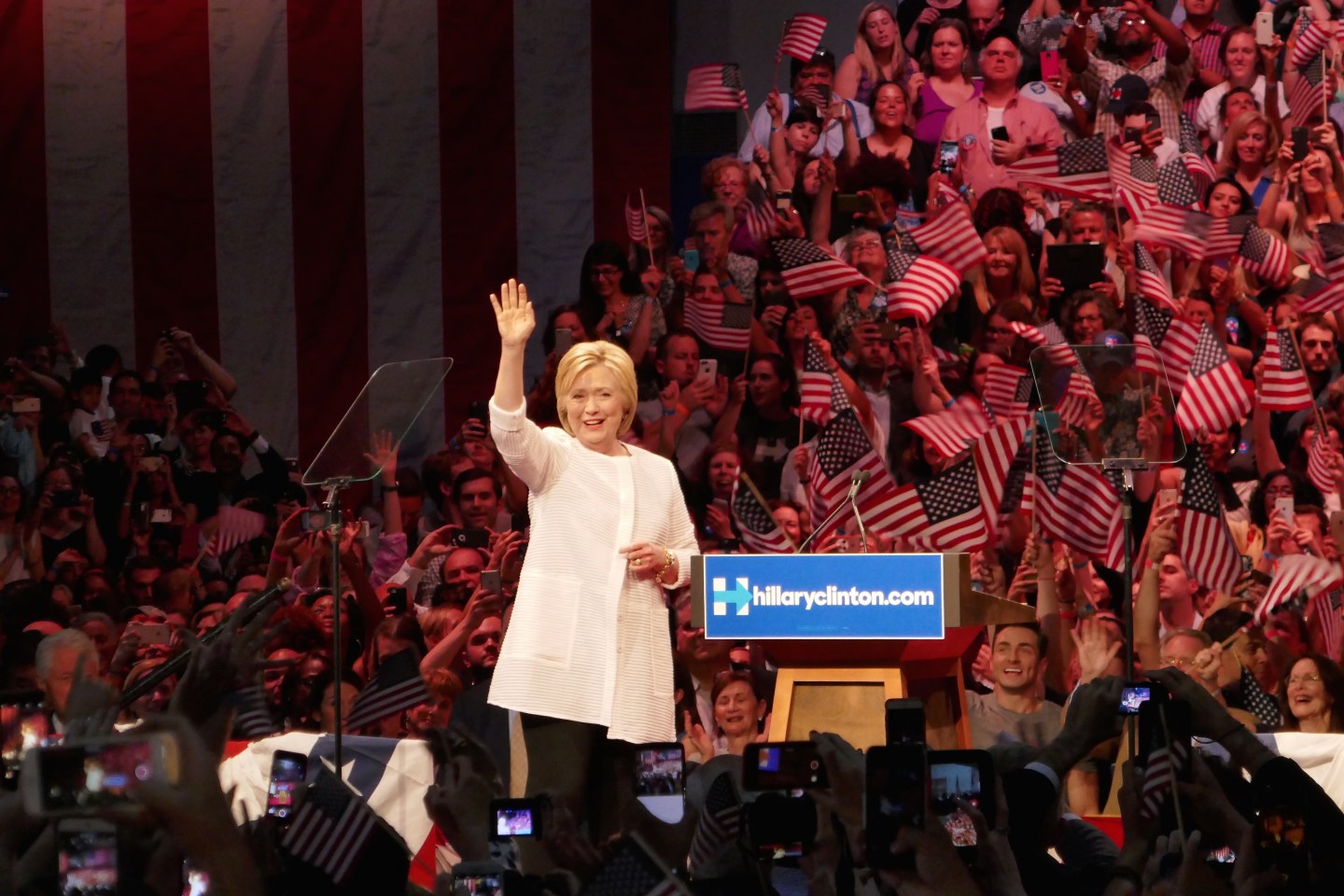 Clinton claims nomination as primaries near end