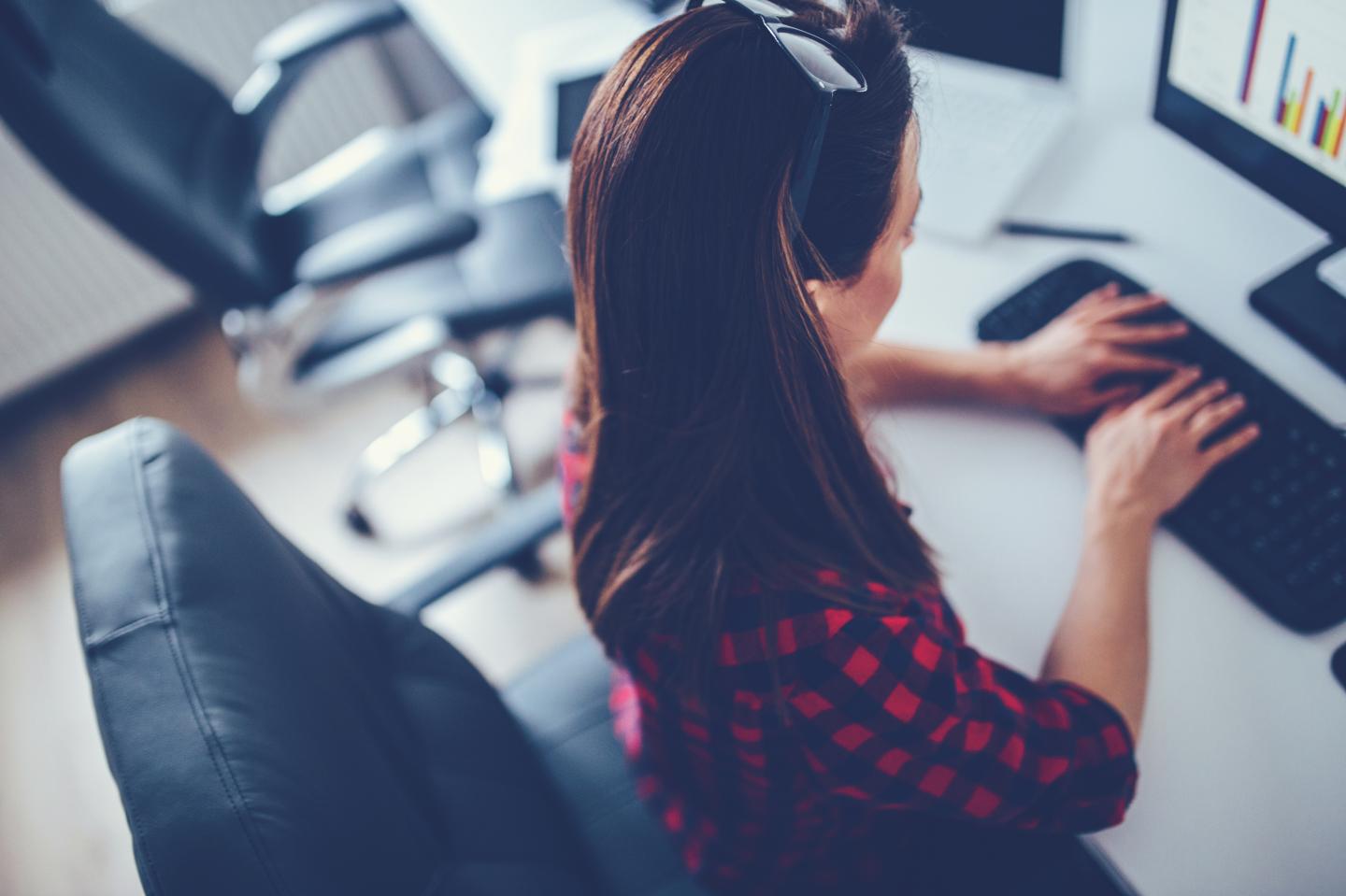Girl typing in firm