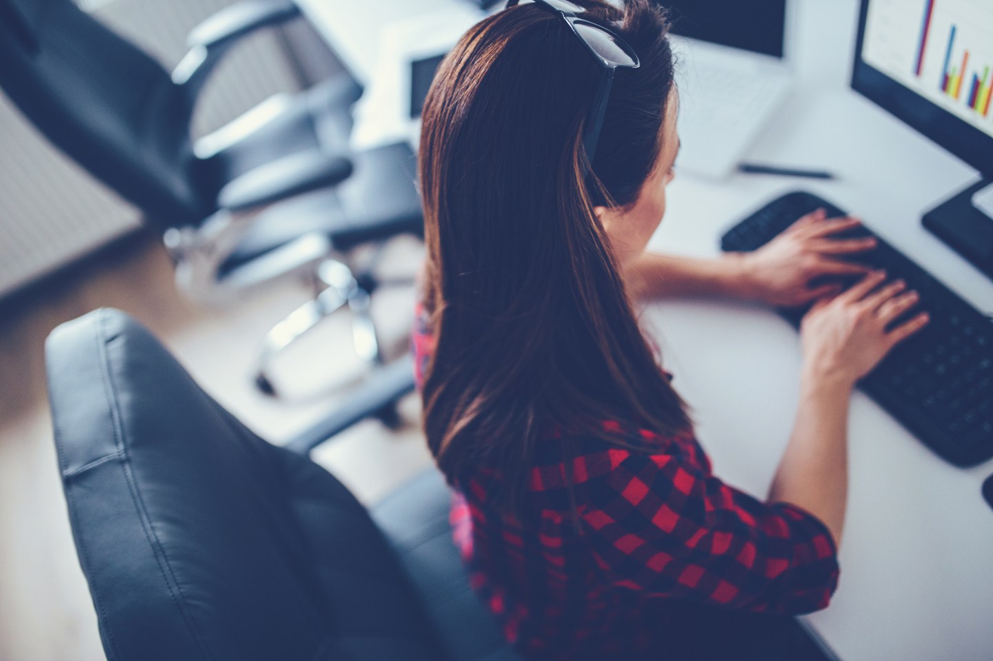 Girl typing in firm