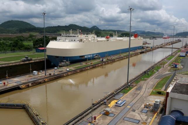 A cargo ship is pictured crossing through the Miraflores locks, in Panama City, Panama