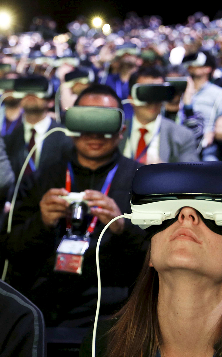 People wear Samsung Gear VR devices as they attend the launching ceremony of new Samsung S7 and S7 edge smartphones during the Mobile World Congress in Barcelona