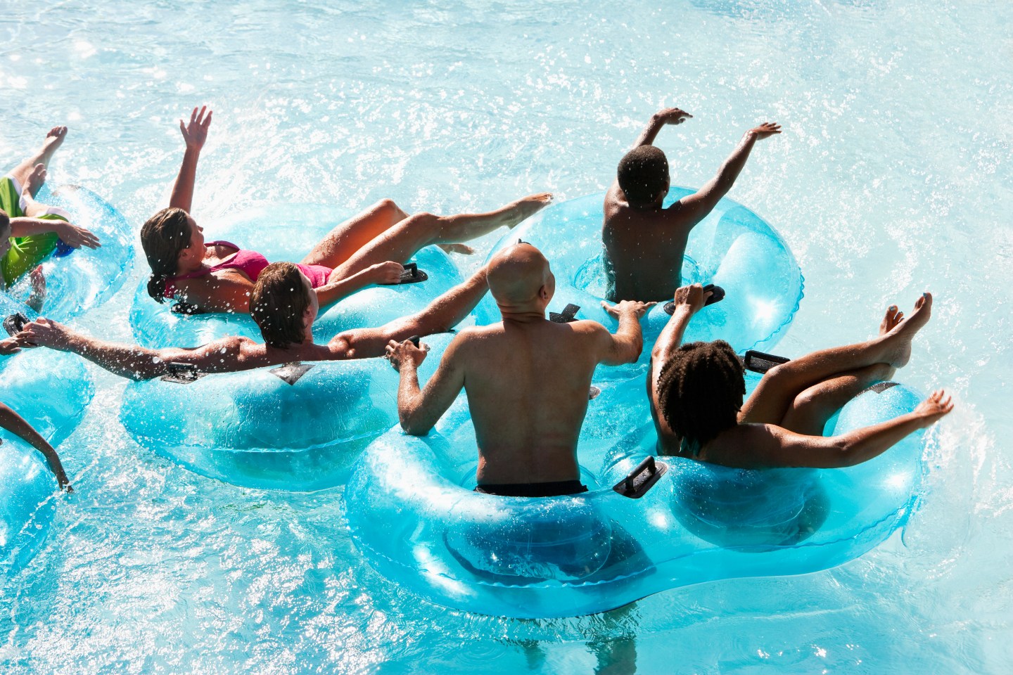 Group of people on innertubes at water park