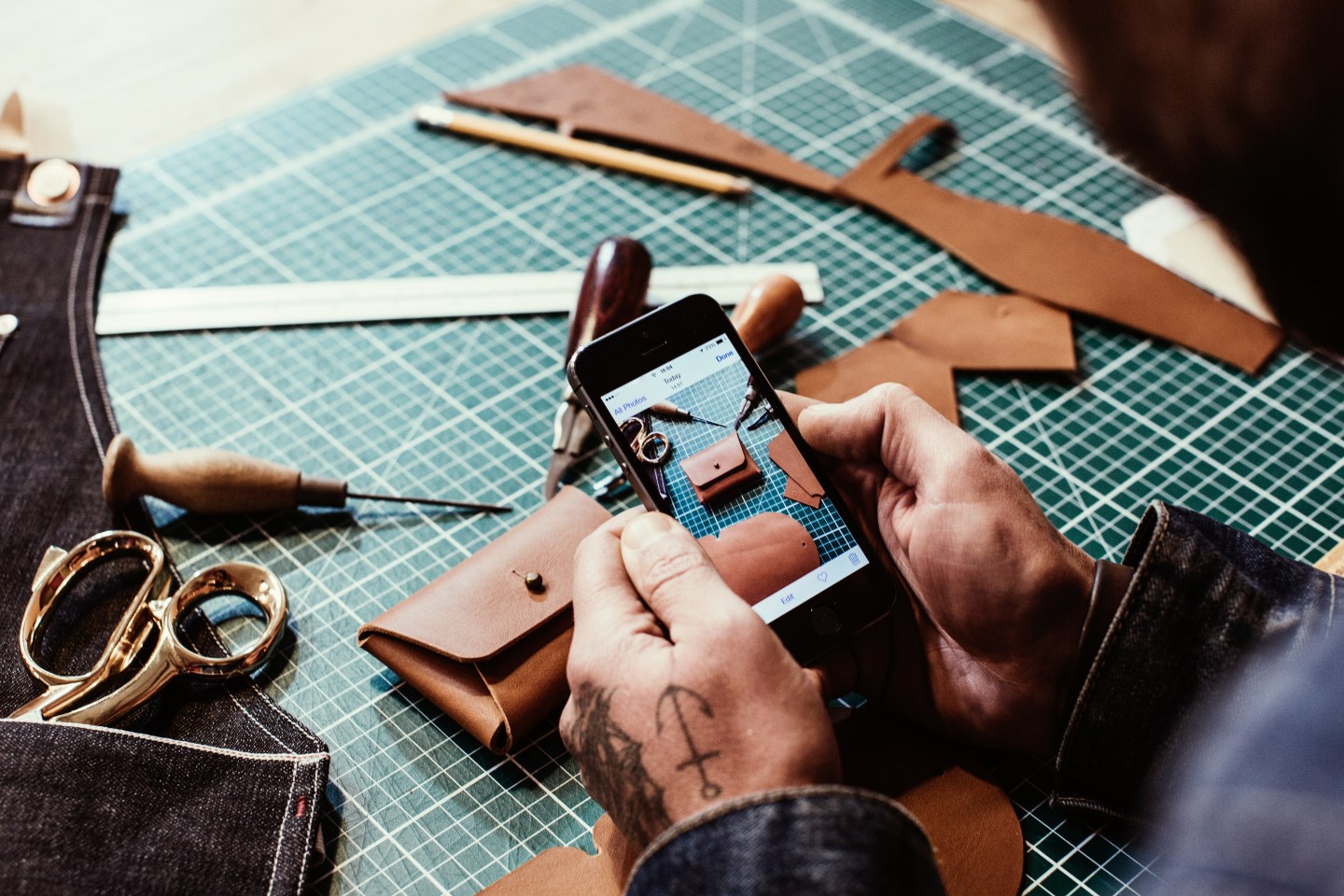 Small Business owner reviews photos of products