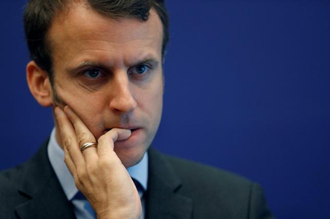 French Economy Minister Emmanuel Macron attends a news conference to update lawmakers and the public on his 2015 deregulation bill in Paris