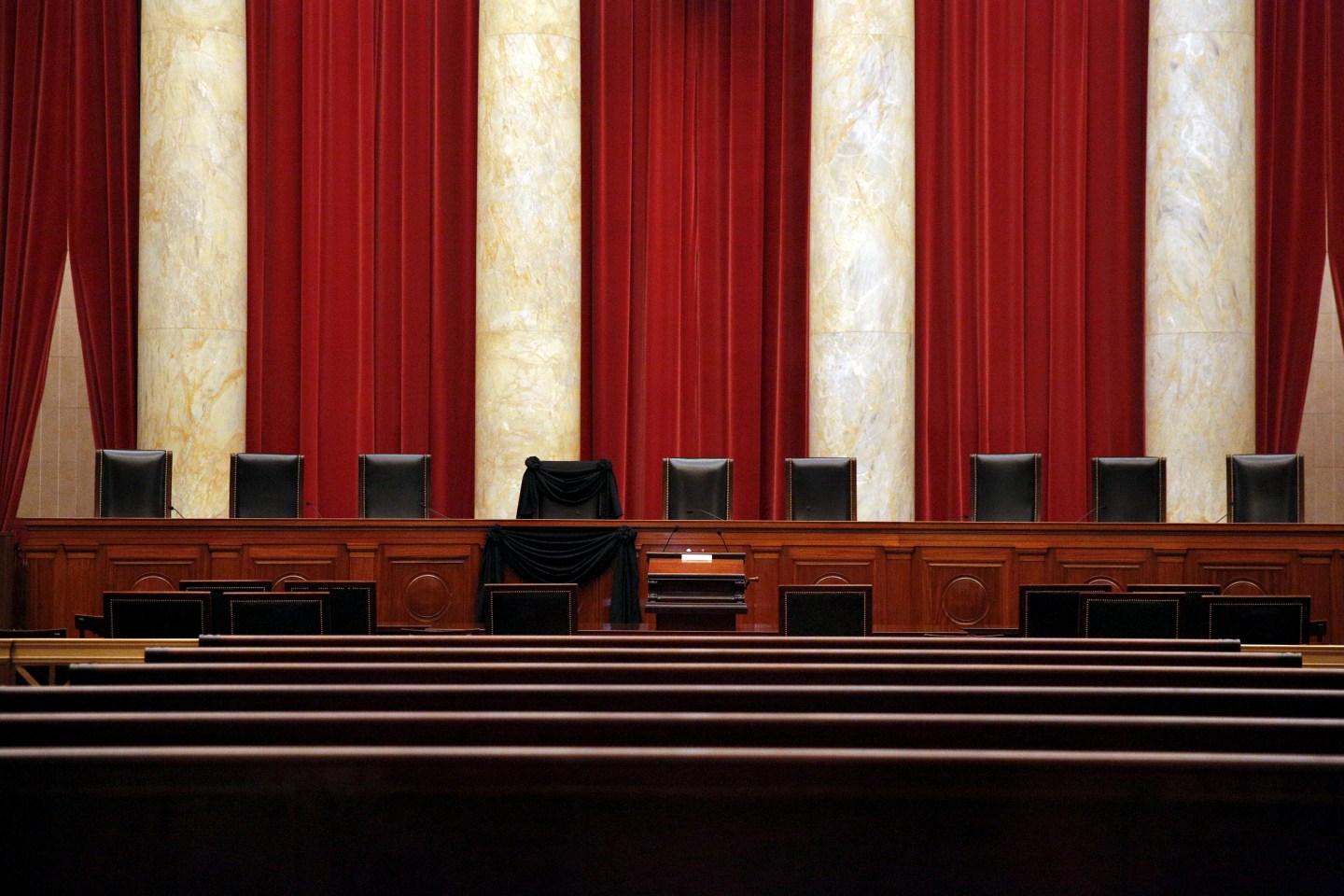 The bench of late Supreme Court Justice Antonin Scalia is seen draped with black wool crepe in memoriam inside the Supreme Court in Washington