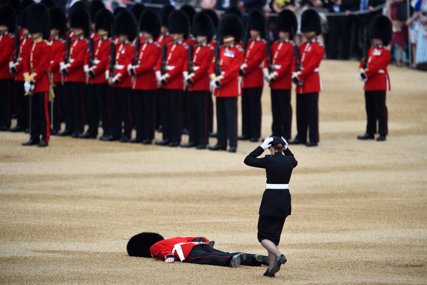 A Guardsman faints at Horseguards Parade for the annual Trooping the Colour ceremony in central London