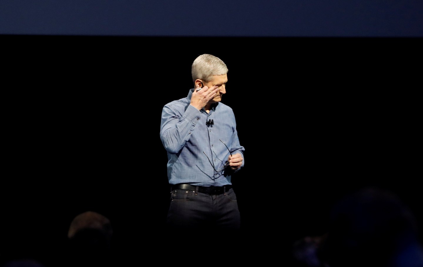 Apple Inc. CEO Tim Cook wipes his eyes after leading a moment of silence for the victims of the attack in Orlando as he opens the company's World Wide Developers Conference in San Francisco, California