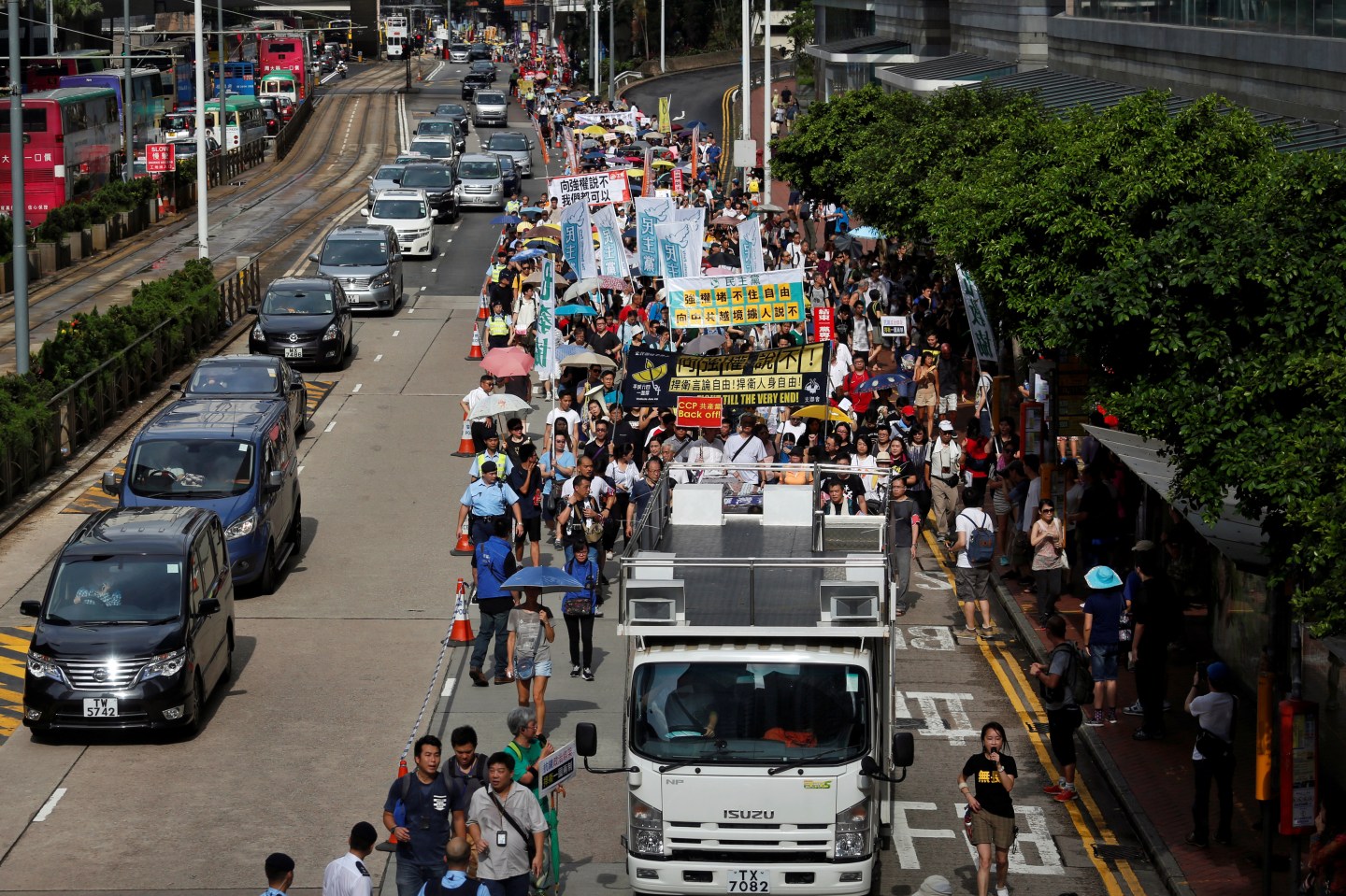 Supporters of bookseller Lam Wing-kee take part in a protest march in Hong Kong