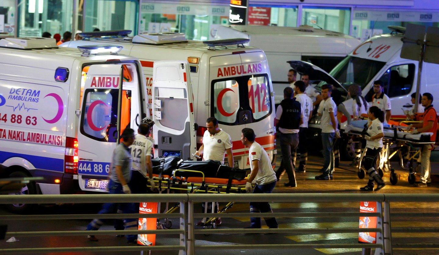 Paramedics push a stretcher at Turkey's largest airport, Istanbul Ataturk