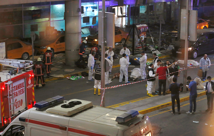 Forensic experts work outside Turkey's largest airport, Istanbul Ataturk, Turkey, following a blast